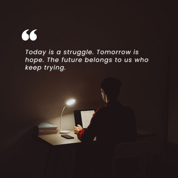 Person working late at desk with motivational quote, symbolizing Shopify problem solving and consulting by JFK Løvlien