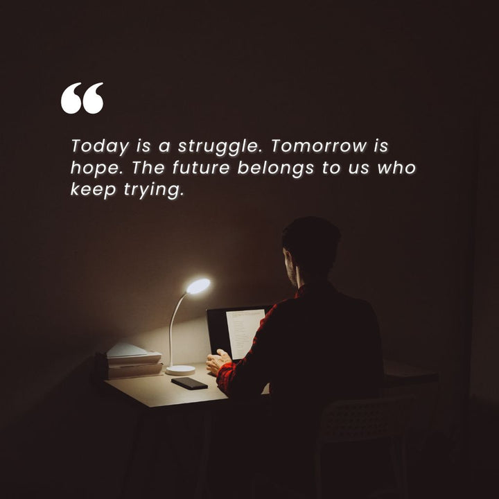 Person working late at desk with motivational quote, symbolizing Shopify problem solving and consulting by JFK Løvlien